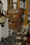 An unusual Eastern engraved copper kettle on brazier stand.
