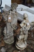 Two composite garden figural ornaments.