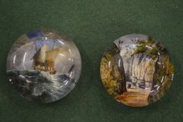 Two small glass paperweights.
