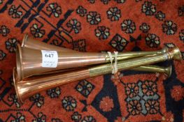 Three small hunting horns.