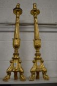 A pair of giltwood alter candlesticks.