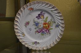 A set of four Dresden floral decorated plates.