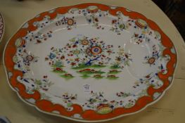 A floral decorated 'tree and well' meat dish.