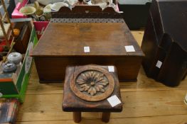 A large candle box and a small carved stool.
