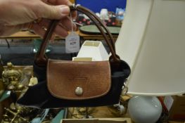 A small ladies' handbag.