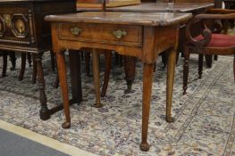 A 18th century walnut single drawer lowboy.