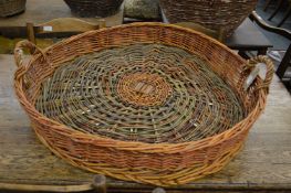 A wicker twin handled basket.