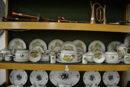 A quantity of Denby dinnerware, decorated with stylised green flowers.