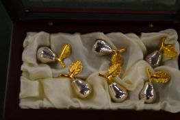 A set of six pear shaped place name holders, boxed.