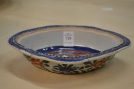 A Chinese 'clobbered' oval shaped dish.