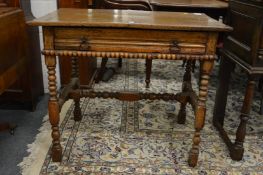 A 18th century oak single drawer side table.