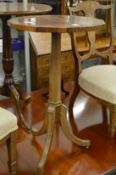 A brass inlaid rosewood tripod table.