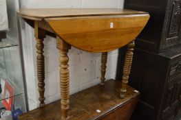 A French fruit wood dropleaf table.