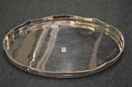 A silver plated oval twin handled galleried tray.