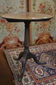 A George III mahogany tilt top tripod table.