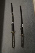 Two reproduction samurai swords.
