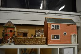 A doll's house with accessories together with other decorative items.