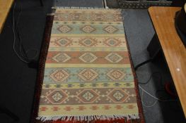 A modern flat weave Kelim rug 150cm x 93cm.