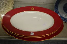 Three oval meat plates.