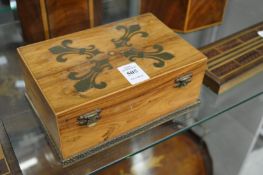 A brass inlaid walnut box.