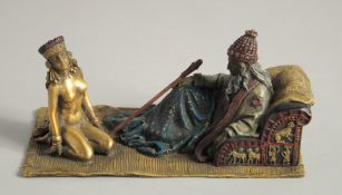 A COLD CAST GROUP OF A MAN sitting in a chair with a nude kneeling. 7ins long.