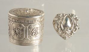 A SMALL FRENCH OVAL SILVER BOX AND COVER 1.25ins and a heart shaped box. (2).