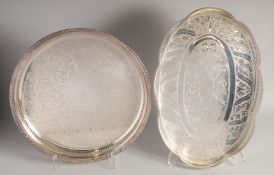 TWO SILVER PLATED TRAYS WITH GALLERIES. 14ins diameter and 17ins long.