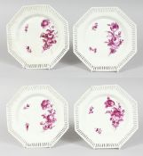 A SET OF FOUR PIERCED OCTAGONAL BERLIN PLATES, flowers in sepia. Sceptre mark, 8ins diameter.