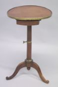 A 19TH CENTURY FRENCH CIRCULAR TOP CAMPAIGN TABLE on tripod base.