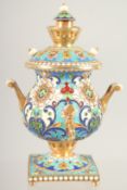 A MINIATURE RUSSIAN SILVER GILT AND CLOISONNE ENAMEL SAMOVAR. 3.75ins high, Mark 84