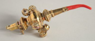 A GOLDSMITH AND SILVERSMITH'S ASPREY & CO. LTD. SILVER GILT BABY'S RATTLE with coral end. London