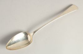 A GEORGE III SILVER LONG HANDLED GRAVY SPOON. 12ins long. London1808. Maker S. H.