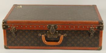 A LOUIS VUITTON SUITCASE. No. 810009 with Louis Vuitton label and ARTHUR GILBERT, New York. Lock no.