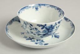 AN 18TH CENTURY WORCESTER TEA BOWL AND SAUCER painted with an early version on the Mansfield