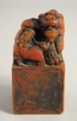 A CHINESE CARVED SOAPSTONE DRAGON SEAL. 4ins high.