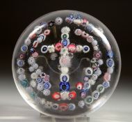 A MILLEFIORI CRUCIFIX PAPERWEIGHT. Possibly CLICHY. 3.5ins diameter.