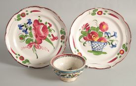 A PAIR OF CONTINENTAL PLATES painted with flowers in a basket 8.5ins diameter and A SMALL BOWL 4.