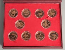 A COLLECTION OF TEN CHINESE COINS in presentation box.