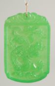 A GOLD TOP DRAGON JADE PENDANT. 2ins.