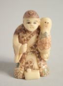 A BONE NETSUKE OF A MAN. Signed, 1.75ins.