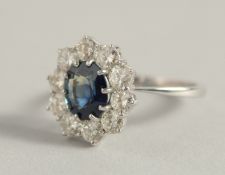 A SUPERB 18CT WHITE GOLD, SAPPHIRE AND DIAMOND CLUSTER RING. Ring size between R & S.