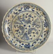 A CHINESE MING STYLE BLUE AND WHITE PLATTER. 1ft 11ins diameter.