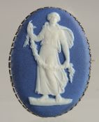 A WEDGWOOD BLUE JASPER AND SILVER BROOCH.