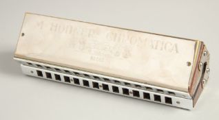 M. HOHNER. CHROMATIC BOSS HARMONICA. No. 265. 8.5ins long, in a case.