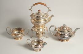 A GOOD GEORGIAN SILVER PLATE THREE PIECE TEA SET AND SIMILAR KETTLE ON STAND (4).