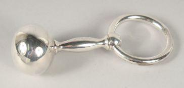 A BABY'S SILVER RATTLE in a white box.