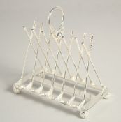 A SILVER PLATED SIX DIVISION TOAST RACK with cross golf clubs.