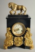 A GOOD FRENCH GILT BRONZE AND BLACK MARBLE CLOCK with lion surmount. 1ft 5ins high.