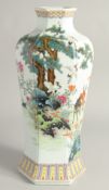 A CHINESE FAMILLE ROSE HEXAGONAL FORM VASE decorated with deer and cranes in a woodland setting.