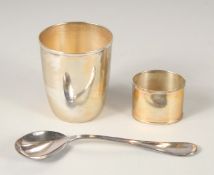 ARGENTO. A THREE-PIECE SILVER CHRISTENING SET. Tumbler, serviette ring, and spoon. Cased.